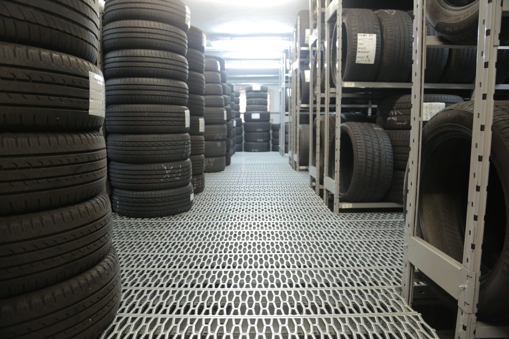 Tire storage area representing Loans for auto shops, body shop financing, auto repair shop acquisition financing, garage expansion financing, and repair shop buyout loans for automotive business owners.